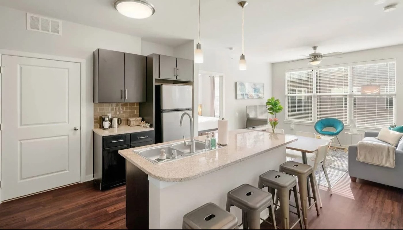 Large kitchen with wood floors and a lot of natural light