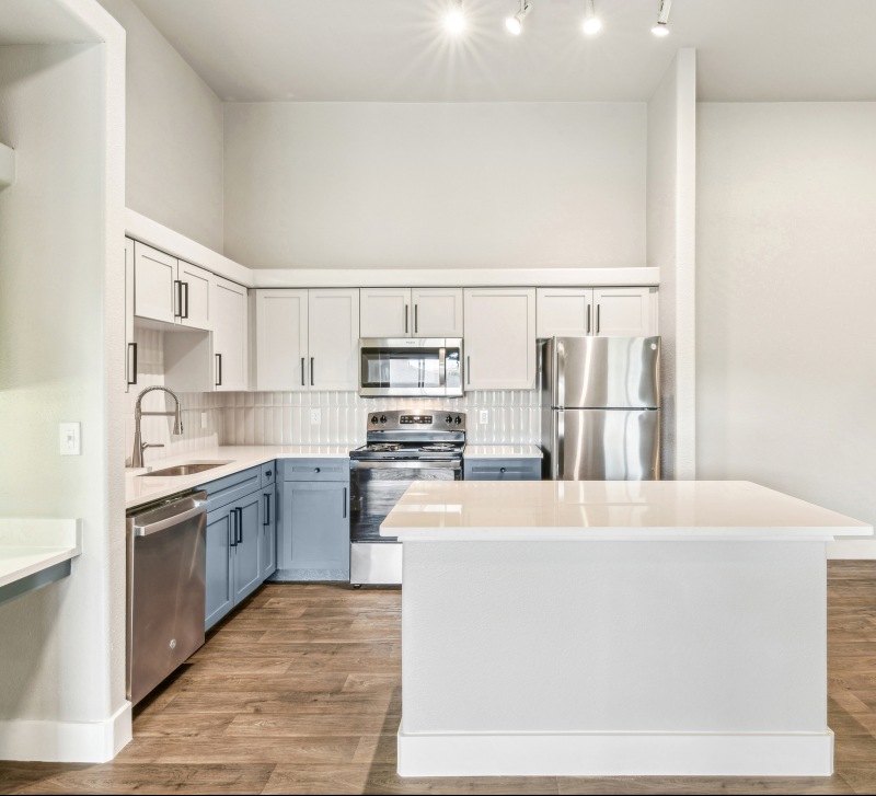 Well lit kitchen with large island