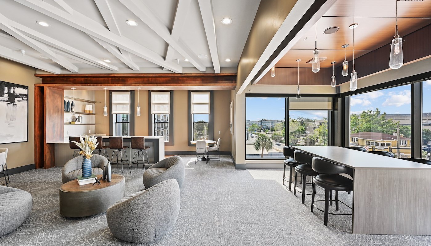 Large well lit lounge area with large windows